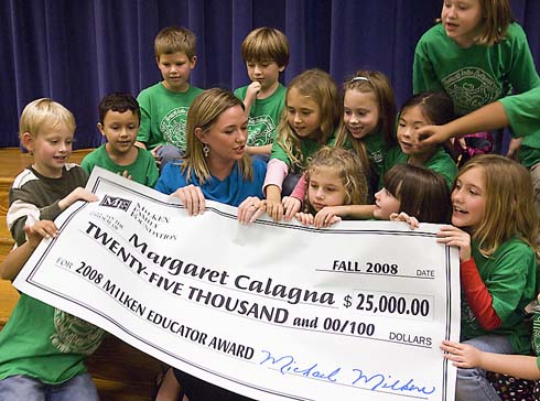 Armand Bayou Elementary School Second-grade teacher Maggie Calagna and her students gather behind an oversized check representing her $25,000 Milken Educator Award.