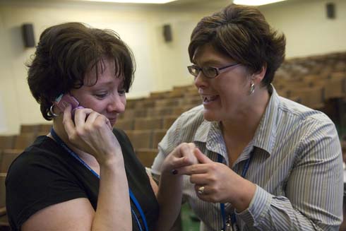 Daniel R. Cameron Elementary School 'I'm serious,' says Ronelle Robinson as she calls her husband to tell him the news about her surprise $25,000 Milken Educator Award, as her colleague, TAP lead teacher Denise Makowski, looks on.