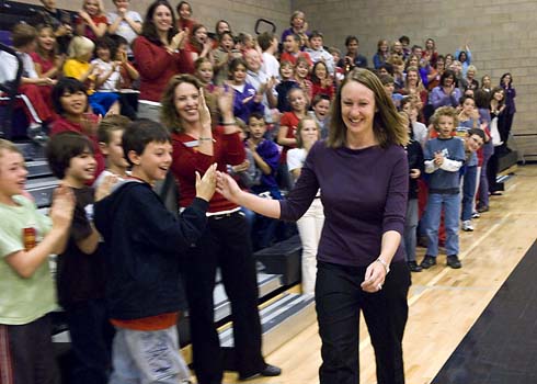 Discovery Canyon Campus As students and colleagues cheer her on, teacher Trisha Brennan steps forward to accept a surprise $25,000 Milken Educator Award.