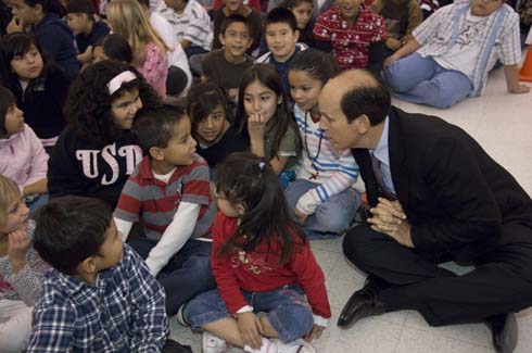 Empire Elementary School Milken Institute Chairman Michael Milken (right) chats with students at Empire Elementary School.