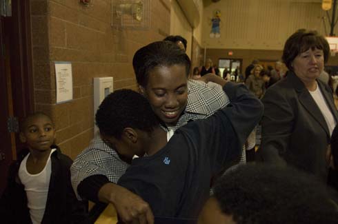 Fontenelle Elementary School Crystal Simpson gets a congratulatory hug from a Fontenelle Elementary student after being surprised with a $25,000 Milken Educator Award.