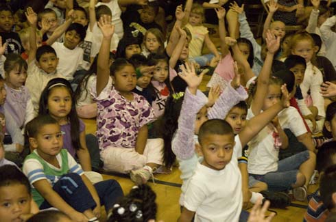 Garden City Elementary School Garden City Elementary students eagerly raise their hands to answer a question.