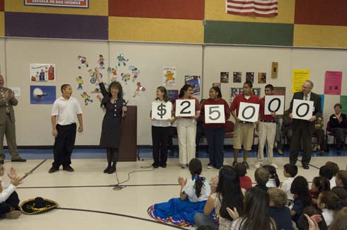 Horace Mann Dual Language Magnet School Horace Mann students hold up cards displaying the amount of the Milken Educator Award, which is about to go to a truly outstanding educator at their school.
