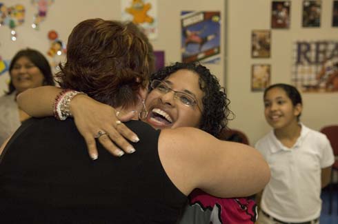 Horace Mann Dual Language Magnet School A colleague gives Vanessa Martinez a congratulatory hug for her $25,000 Milken Educator Award.