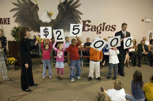 Horn Lake Elementary School Horn Lake Elementary students hold up cards displaying the amount of the Milken Educator Award, which is about to go to one of their unsuspecting educators.