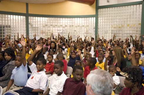 Thelma Smiley Morris Elementary School Morris Elementary students raise their hands, hoping to be called on to answer questions from Dr. Jane Foley, senior vice president of the Milken Educator Awards.