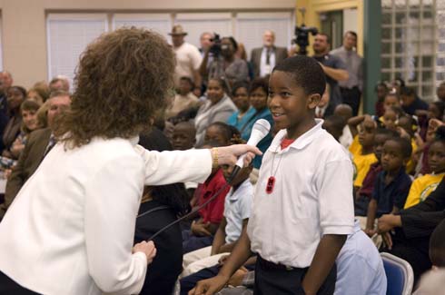 Thelma Smiley Morris Elementary School Dr. Jane Foley, senior vice president of the Milken Educator Awards, gets some help from a Morris Elementary student as she makes a special announcement.