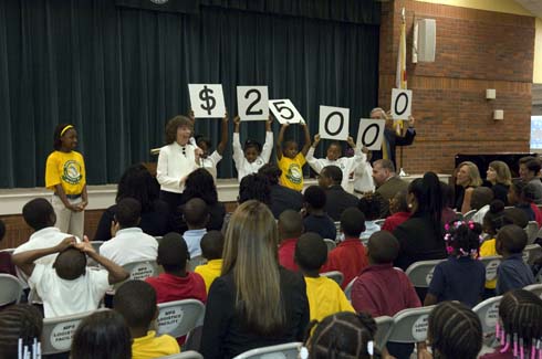 Thelma Smiley Morris Elementary School Morris Elementary students hold up cards displaying the amount of the Milken Educator Award, which is about to be presented to one of their unsuspecting teachers.