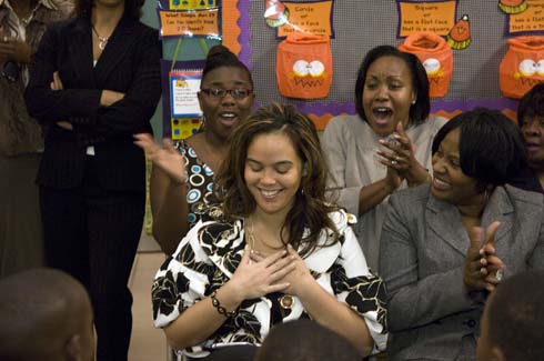 Thelma Smiley Morris Elementary School Math coach Stephanie Glover reacts with shock when her name is announced as the recipient of a $25,000 Milken Educator Award.