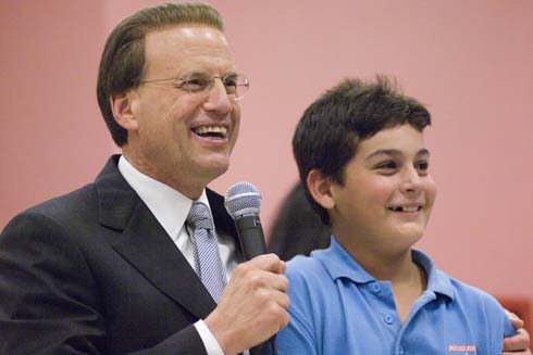 North Alamo Elementary School Milken Family Foundation Chairman Lowell Milken smiles after a North Alamo Elementary student gives him the correct answer to his question.