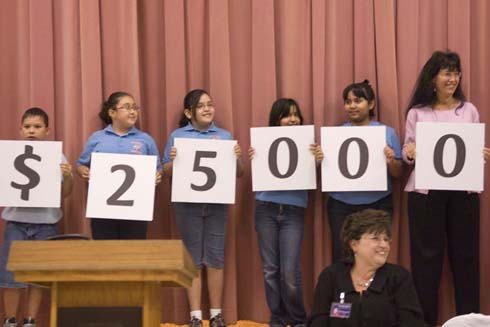 North Alamo Elementary School North Alamo Elementary students and Milken Family Foundation Trustee Joni Milken-Noah hold up cards displaying the amount of the Milken Educator Award, which is about to go to an outstanding and unsuspecting North Alamo teacher.
