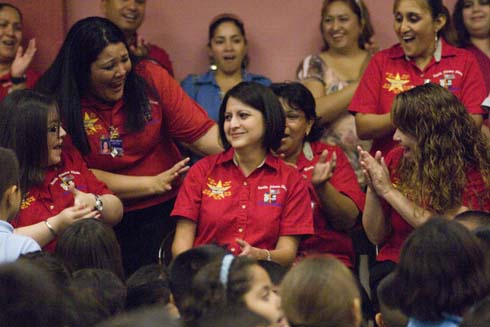 North Alamo Elementary School Teacher Claudia Peña reacts with stunned disbelief as her colleagues cheer excitedly for her surprise $25,000 Milken Educator Award.
