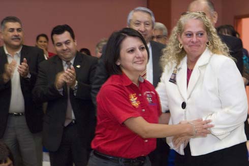 North Alamo Elementary School Teacher Claudia Peña steps forward to accept her $25,000 Milken Educator Award.