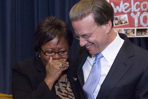 John J. Pershing West Magnet School Cheryl Watkins, principal of Chicago's John J. Pershing West Magnet School, reacts with tearful emotion after being surprised by Milken Family Foundation Chairman Lowell Milken (left) with a $25,000 Milken Educator Award.