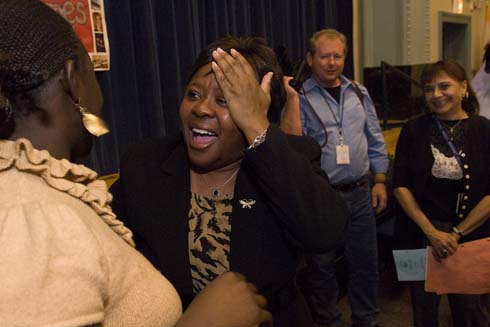 John J. Pershing West Magnet School Principal Cheryl Watkins talks to a colleague as she tries to recover from the shock of being surprised with a $25,000 Milken Educator Award.