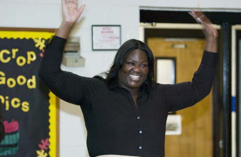 Rock Chapel Elementary School <b><a href='http://www.mff.org/mea/mea.taf?page=recipient&meaID=22534'>Andrea A. King</a></b> throws her arms up in jubilation after being surprised with a $25,000 Milken Educator Award.