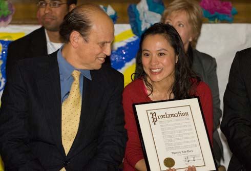 Visitacion Valley Elementary School Milken Family Foundation Co-Founder Mike Milken chats with new Mindy Yip, who is holding a proclamation from Mayor Gavin Newsom declaring November 24 as 'Mindy Yip Day.'