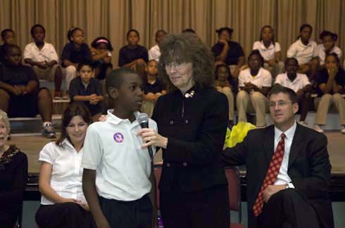 F. B. Woodley Elementary School A Woodley Elementary student tells Dr. Jane Foley, senior vice president of the Milken Educator Awards, what a 'financial award' is.  'Money,' he says.