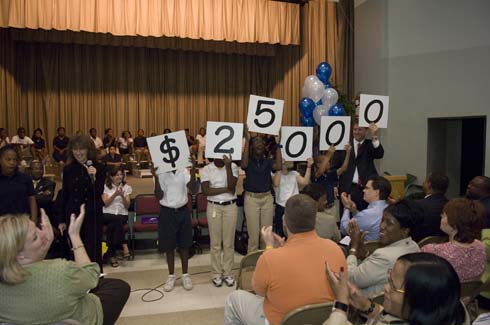 F. B. Woodley Elementary School Woodley Elementary students hold up cards displaying the amount of the Milken Educator Award, which is about to go to one of their outstanding educators.