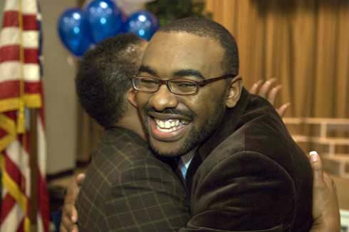 F. B. Woodley Elementary School Aaron Wilson gets a congratulatory hug from a colleague after being surprised with a $25,000 Milken Educator Award.