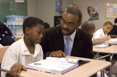 F. B. Woodley Elementary School Milken Educator Aaron Wilson guides a student in his classroom.
